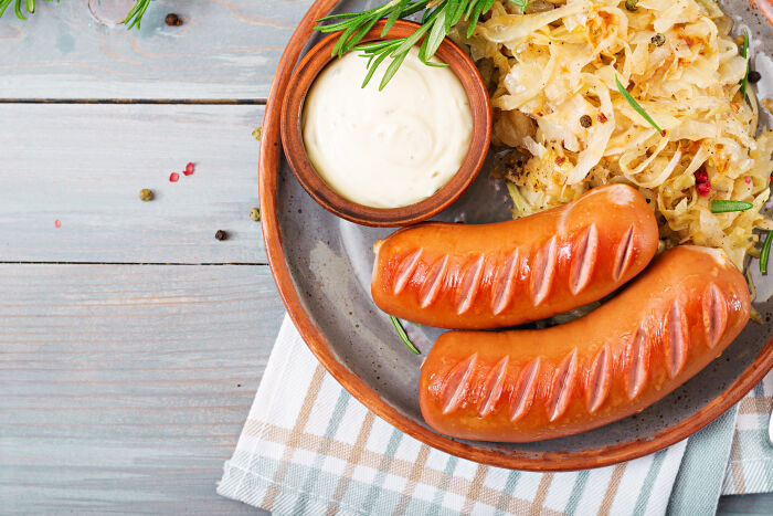 plate-sausages-sauerkraut-wooden-table-traditional-oktoberfest-menu-flat-lay-top-view (2).jpg